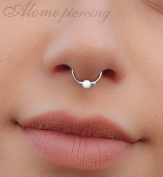 a woman's nose with a nose ring on it