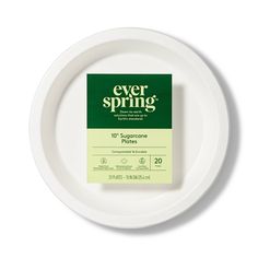 a white plate topped with a green packet of ever spring condoms on top of it