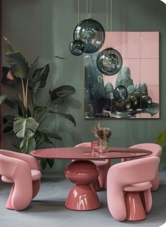 a pink table and chairs in a room