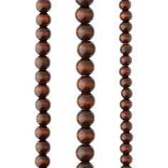 three wooden beads on a white background