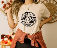 "Have The Day You Deserve Shirt, Skeleton Hand Peace Sign Shirt, Trendy Positive Vibes, Karma Shirt, Motivational Shirt, Halloween Shirt * We choose one of these brands according to stock status; Bella Canvas, Gildan Soft Style, Next Level, Outlash, Tee Factory, and Rustic. If you want a specific brand please tell us. * ---How To Order --- 1-) Please, check and review all photos 2-) Choose your t-shirt size and color 3-) Click add to cart. You can go back to add more product 4-)Click \"Proceed t Peace Sign Shirts, Funny Skeleton, Skeleton Shirt, Ghost Shirt, Halloween Ghost, Costume Halloween, Peace Sign, Sheer Fabrics, Soft Style