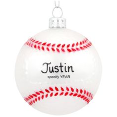 a white ornament with a red stitching on the bottom that says justin