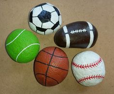 four different types of painted rocks with balls on them