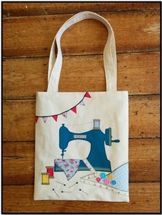 a tote bag with a sewing machine on it