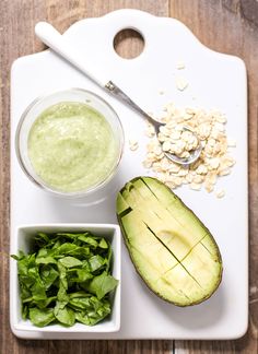 avocado, oatmeal and spinach on a cutting board