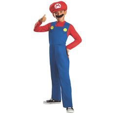 a young boy wearing a mario costume and giving the thumbs up sign with both hands