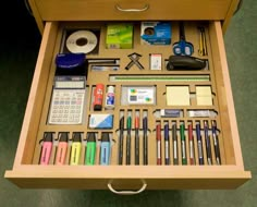 an open drawer filled with office supplies