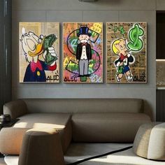 three cartoon paintings hang on the wall in a living room