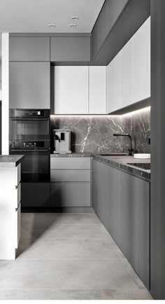 a modern kitchen with marble counter tops and stainless steel appliances in black and white colors