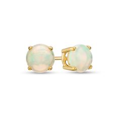 Simple and chic, these gemstone stud earrings add color to any style. Fashioned in warm 10K gold, each earring showcases a 6.0mm iridescent opal cabochon solitaire. Buffed to a brilliant luster, these post earrings secure comfortably with friction backs. Formal Opal Round Earrings, Classic Opal Jewelry With Round Cut, Formal Round Opal Earrings, Classic Round Cut Opal Jewelry, Opal Earrings Stud, Solitaire Studs, Gemstone Stud Earrings, Opal Studs, Gemstone Studs