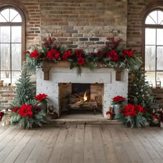 a fireplace decorated for christmas with poinsettis and greenery