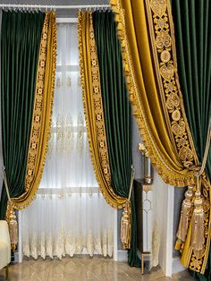 an elegant living room with green and gold curtains