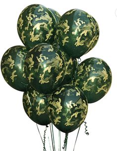 a bunch of green and gold camouflage balloons