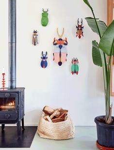 a living room filled with furniture and a fire place next to a potted plant