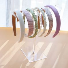 a bunch of bracelets that are on a stand