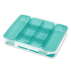 an empty plastic container with compartments filled with food