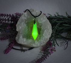 GREEN DROP CRYSTAL Glow in the Dark and Black Light Lamp / Luminous Necklace with Pendant for Unisex / Party Jewelry and Cosplay ❤️ Handmade item ❤️ GLOW IN THE DARK ❤️rechargeable with black light ❤️WITH chain ❤️ easy to wear ❤️ own ideas ❤️ Artist name / own brand ❤️ Quality checked ❤️ Exceptional jewelry ❤️ Shipping from Germany ❤️ Fast shipping to Germany ❤️ Each product is unique and one of a kind Our unique neon green glowing crystal necklace is a fascinating piece of jewelry for young adu Green Halloween Party Jewelry, Green Luminous Jewelry For Party, Luminous Green Jewelry For Party, Black Glow In The Dark Jewelry For Parties, Black Glow In The Dark Party Jewelry, Glowing Crystal Necklace, Luminous Necklace, Glowing Crystal, Necklace With Pendant