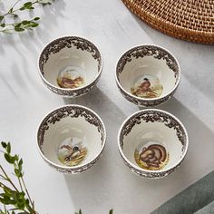 four small bowls sitting on top of a table