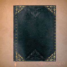 an old black leather book with gold trimmings