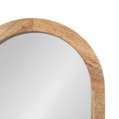 a wooden mirror with a white background