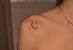 a woman with a crescent tattoo on her chest