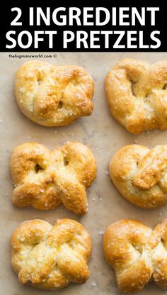 six biscuits are arranged in the shape of an x on a sheet of parchment paper