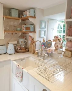 a kitchen filled with lots of white counter top space