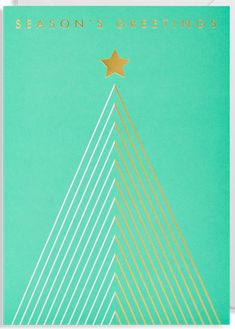 a christmas card with the words season's greetings written in gold and green