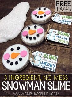 three snowman slime tags on a wooden table