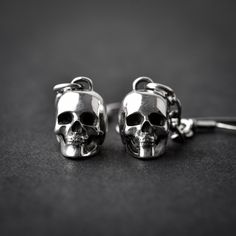 Handmade sterling silver 925 hung 3D skull earrings. Each earring is cleaned and polished with care. Approx weight: 2.75gr (each) Skull hight: 11.64mm Skull width: 8mm The earring is made of sterling silver 925 and is water resistant. *The listing is for ONE earring Here are some listings that you might also love: https://www.etsy.com/il-en/listing/560249661/skull-necklace-silver-skeleton-skull https://www.etsy.com/il-en/listing/528268224/skull-nacklace-sterling-silver-silver https://www.etsy.co Nickel Free Sterling Silver Skull Ring, Nickel-free Sterling Silver Skull Ring, Silver Skull Earrings With Skull Print, Gothic Sterling Silver Jewelry With Skull Print, Nickel-free Sterling Silver Skull Jewelry, Gothic Sterling Silver Skull Earrings, Silver Skull Earrings For Pierced Ears, Skull Shaped Metal Earrings, Silver Skull Earrings With Ear Wire