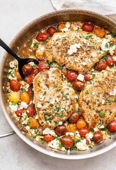 This baked chicken with feta and tomatoes is a one pan dinner and can be ready in 30 minutes! Juicy chicken is nestled in a white wine, tomato, feta sauce. Feta Cheese And Chicken Recipes, Tomato Feta Chicken Bake, Cherry Tomato Chicken Recipes, Tomato And Feta Bake, Chicken Cherry Tomato Recipe, Feta And Tomato Bake, Chicken Feta Tomato Recipe, Chicken And Cherry Tomato Recipes