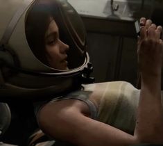 a woman in an astronaut's helmet is holding her cell phone