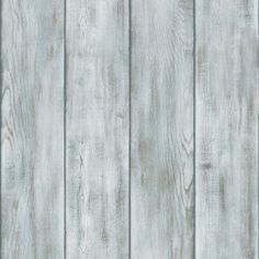 a wooden wall with white paint and wood grains on the boards, as if it were painted in gray