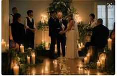 a couple getting married in front of candles