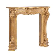 an ornate gold fireplace mantel with carvings on the front and sides, isolated against a white background