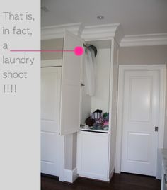 an open closet with clothes hanging on the door