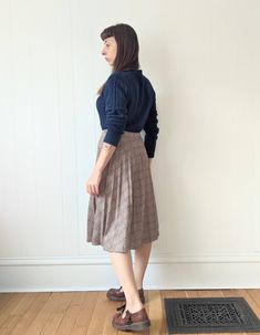 "Vintage Pleated Plaid Skirt  era: 1970s Polyester Wool Acrylic blend  Made in Canada by Paris Star Tag reads \"14\" Below the Knee Length Cut High Waisted Elastic Waist Band Good Vintage Condition. The pleats are no longer crisp and the waistband is starting to lose stretchiness, still cute and wearable. MEASUREMENTS Waist 28\" to 32\" Hips 60\" (full) Length 27\" MODEL MEASUREMENTS: HEIGHT 5' 4\" BUST 34\" WAIST 28\" HIPS 36\" Combine multiple items to save on shipping!  Be sure to check out our shop policies!" Vintage Skirt For Fall, Vintage Lined Skirt For Fall, Vintage Flared Skirt Bottoms For Fall, Vintage Midi Skirt Bottoms For Fall, Vintage Flared Skirt For Fall, Vintage Knee-length Relaxed Skirt, Vintage Midi Skirt For Fall, Vintage Fall Skirt, Vintage Full Pleated Skirt, Relaxed Fit