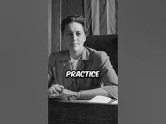 a woman sitting at a desk with the words practice in front of her on it