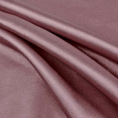 a close up view of the fabric on a bed sheet that is soft and shiny