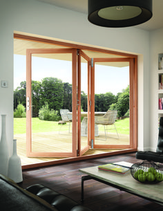 a living room filled with furniture and sliding glass doors