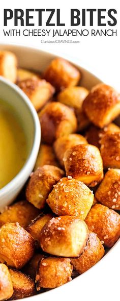 a bowl full of pretzel bites with cheese jalapeno ranch dip