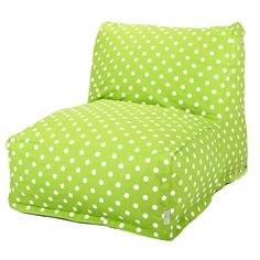 a green chair with white polka dots on it