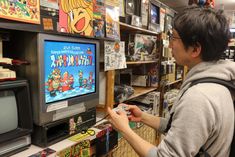 a person playing video games in a store