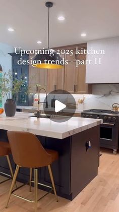 a kitchen with an island and bar stools next to it in front of a window