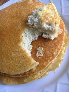 a stack of pancakes with butter on top