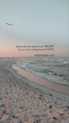 a beach with footprints in the sand and a quote from prove about love on it