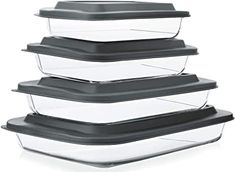 four glass containers stacked on top of each other with black lids and plastic liners