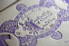 an ornate purple and white wedding card with the word love is written in silver on it