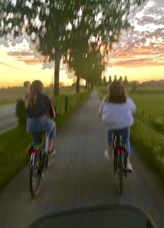 two people riding bikes down a road at sunset with the caption'fantastic about a time when everything was simple '