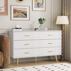 a white dresser with yellow legs in a living room